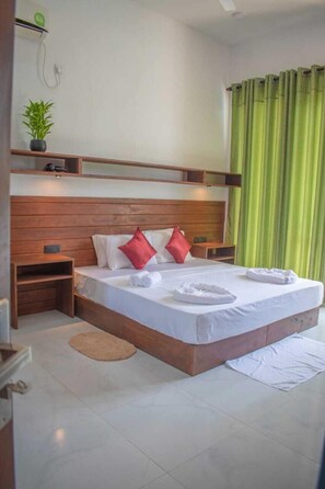 Deluxe Double or Twin Room, Pool View | In-room safe, desk, laptop workspace, blackout drapes