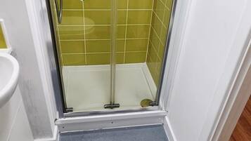 Shower, free toiletries, towels, toilet paper