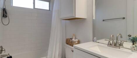 Shower, hair dryer, towels, soap