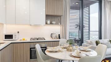 Luxury Apartment, Balcony, City View | In-room dining
