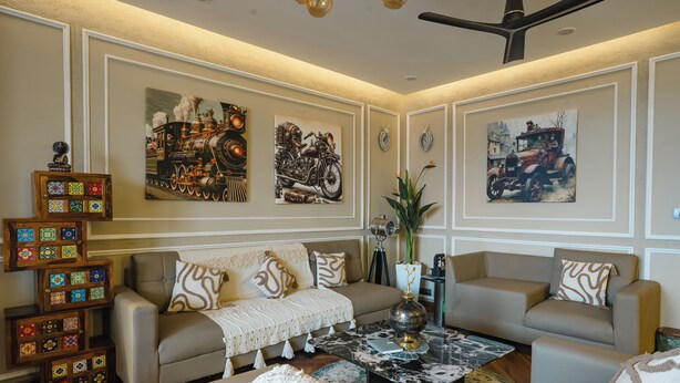 A living room with a sofa, coffee table, and decorative items. - MG Luxury Stays (Panchkula)