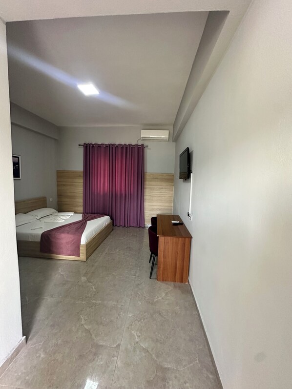 Family Room | Premium bedding, down comforters, memory foam beds, laptop workspace