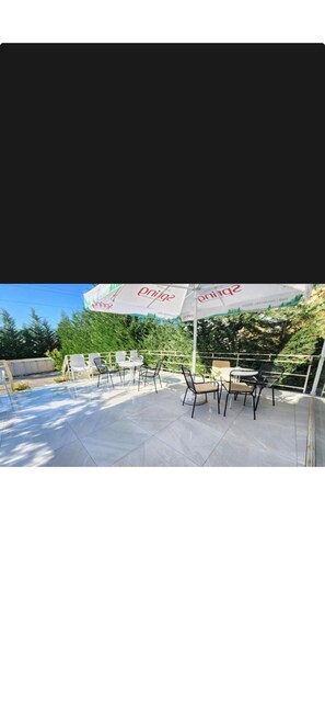 Triple Room, Garden View | Terrace/patio