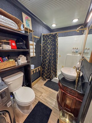 Shower, hair dryer, towels, soap