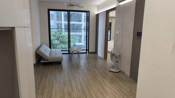 Family Apartment, Balcony, Garden View | Desk, laptop workspace, blackout drapes, soundproofing