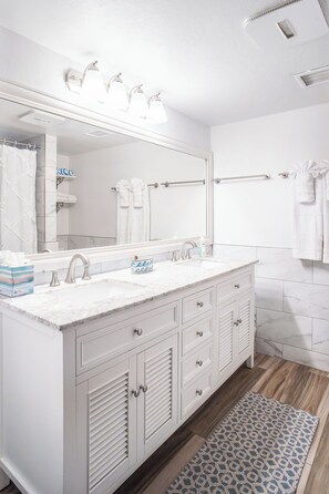 A bathroom with a white vanity, double sink, and a large mirror. - 5 ★ “Sapphire SeaView” - Direct Ocean Front at Sapphire Beach Resort & Marina (St. Thomas)