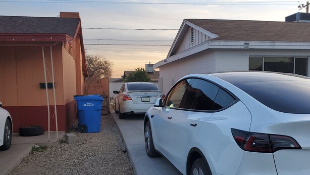 A residential street with houses, a white car parked on the side, and a blue trash bin. - Compact Studio Lovely, Privacy Affordable safe And Quite #3 (Phoenix)