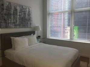 1 bedroom, bed sheets - Upscale 1BR Condo at 1600 Broadway – Prime Location (New York)