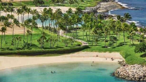 A coastal resort with palm trees, a beach, and a golf course. - Luxury Oasis Resort Villa (Kapolei)