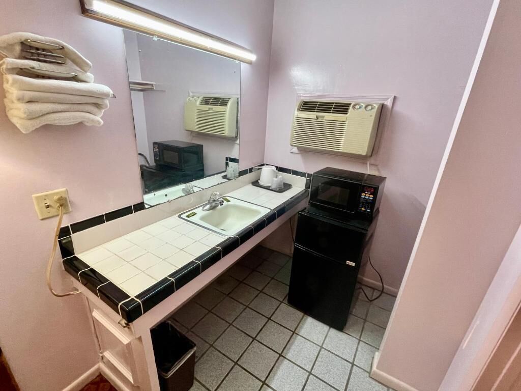 Bathtub, towels, soap, toilet paper