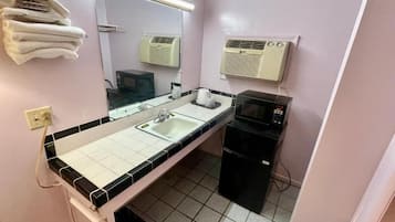 Bathtub, towels, soap, toilet paper