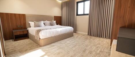 Suite Deluxe, 1 trĂšs grand lit, coin cuisine | Fer et planche Ă repasser, Wi-Fi gratuit