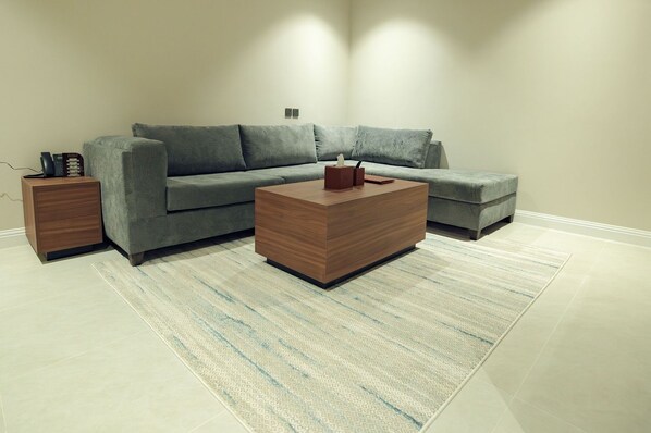 Suite Deluxe, 1 très grand lit, coin cuisine | Coin séjour