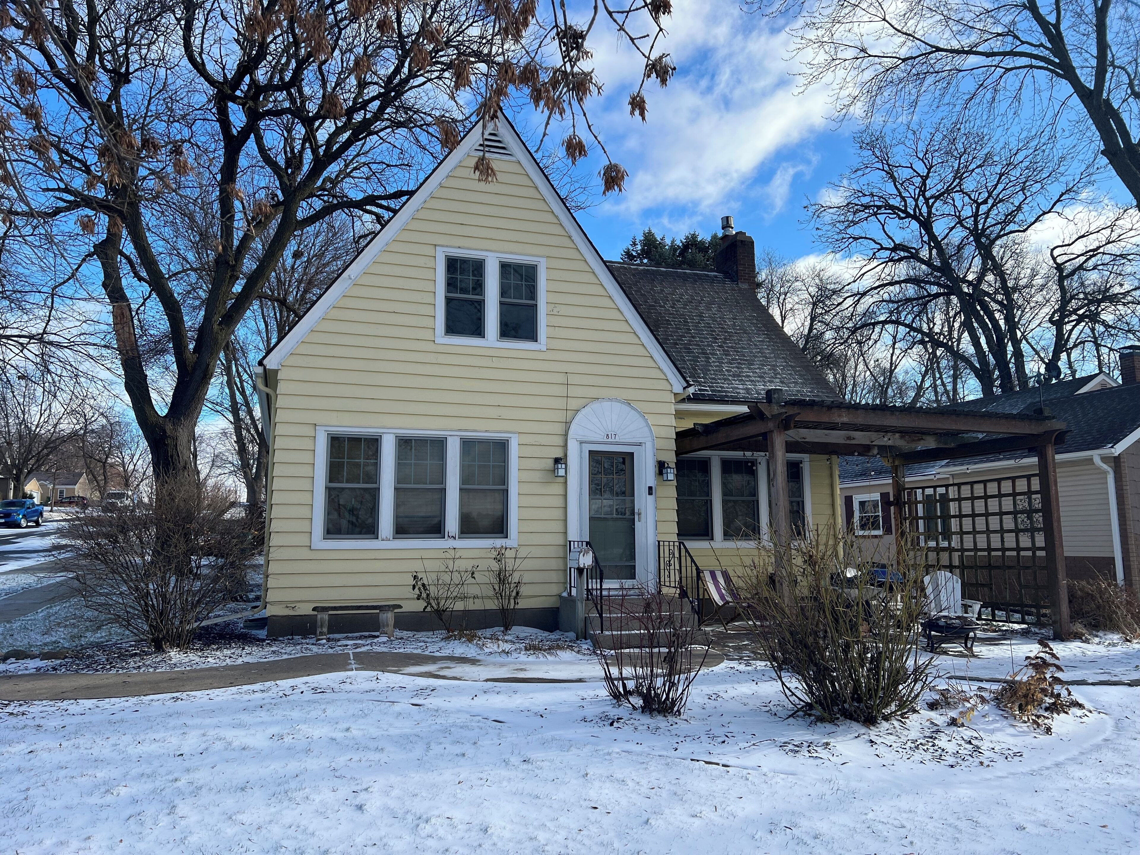A single-story house with a gabled roof, a front porch, and a garage.