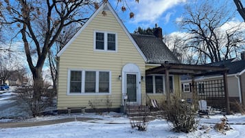 A single-story house with a gabled roof, a front porch, and a garage.