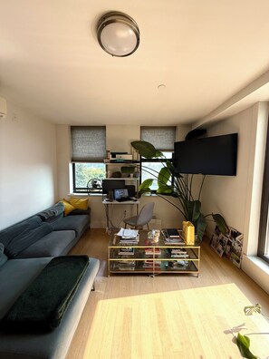 Living area - Sunny 1 Bedroom Apartment in Bushwick w/ Private Terrace, Gym, Game Room (Brooklyn)