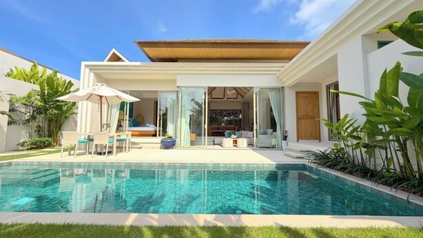 A modern house with a swimming pool, outdoor seating, and a covered patio area. - Luxury 3BR Pool Villa near Blue Tree - Bang Tao (Si Sunthon)