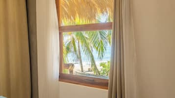 Room Four (Panoramic Room, terrace, hammock, and beach view) | Minibar, in-room safe, WiFi (free), bed sheets