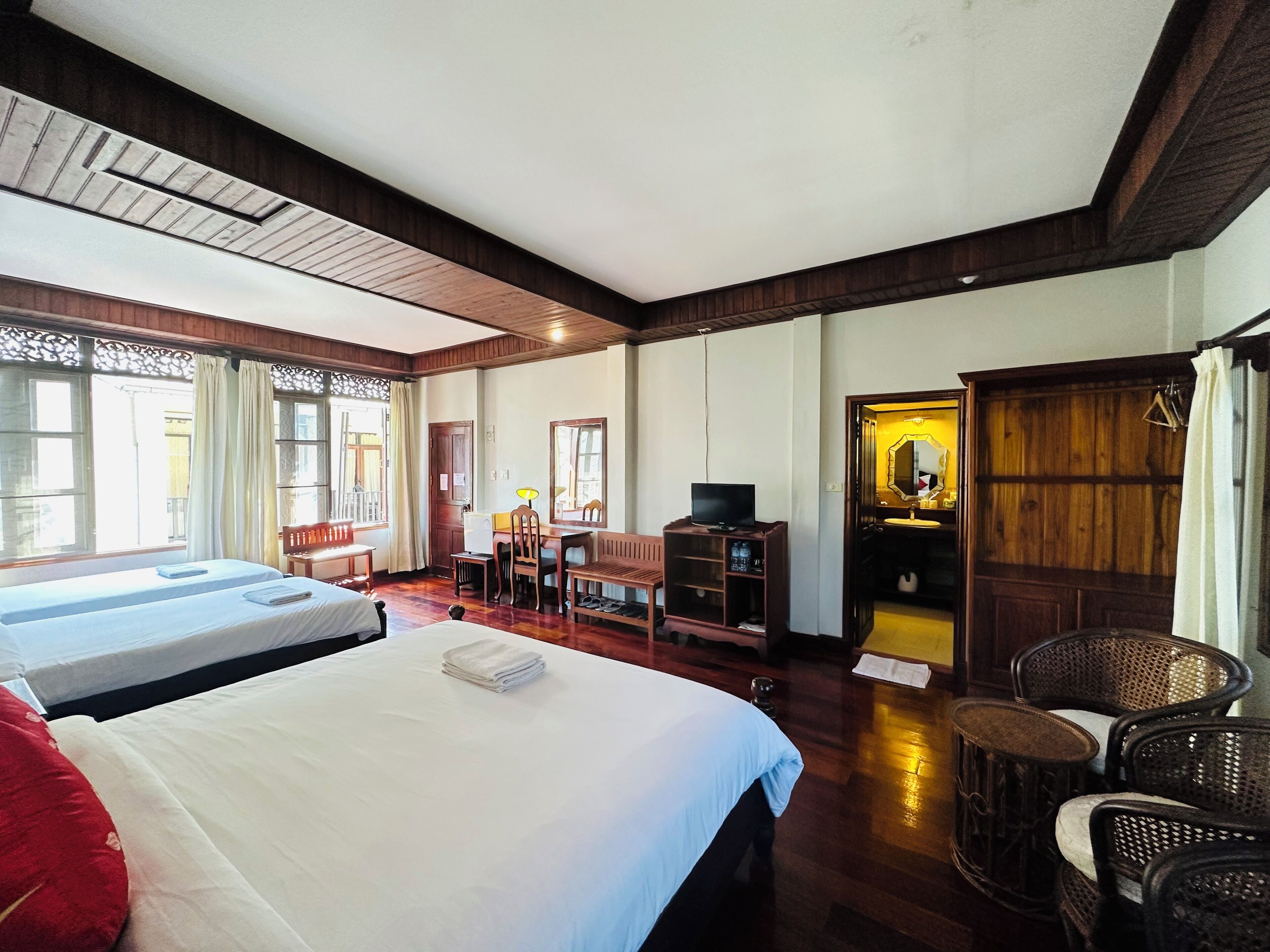 Deluxe Quadruple Room, Courtyard View | Premium bedding, Select Comfort beds, free minibar items, desk