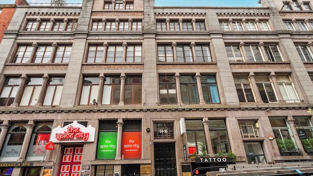 A multi-story building with a classical architectural style, featuring large windows and decorative columns. - Host Stay Apartment 1 Stanley Street (Liverpool)