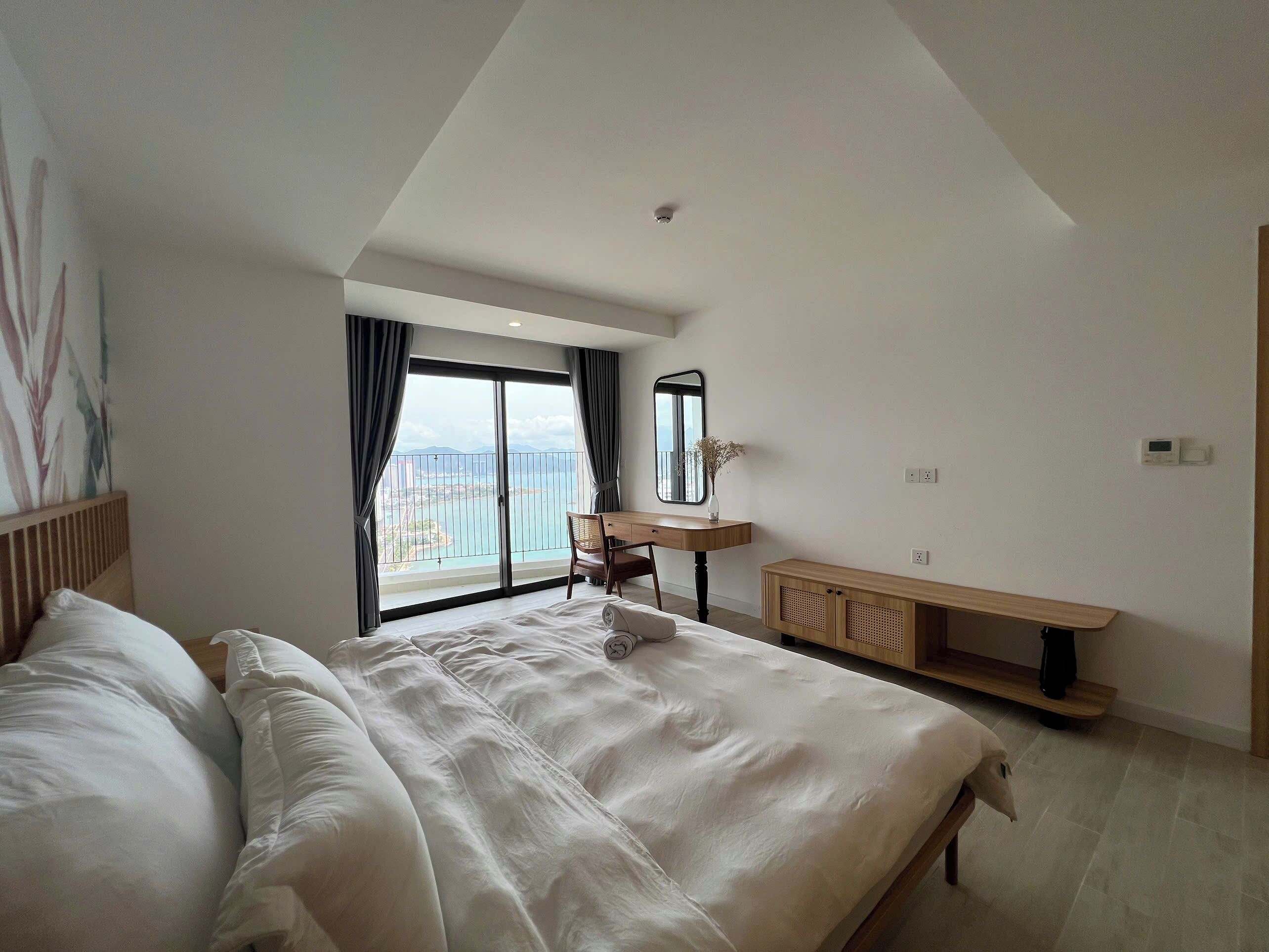 Premium bedding, desk, laptop workspace, blackout curtains