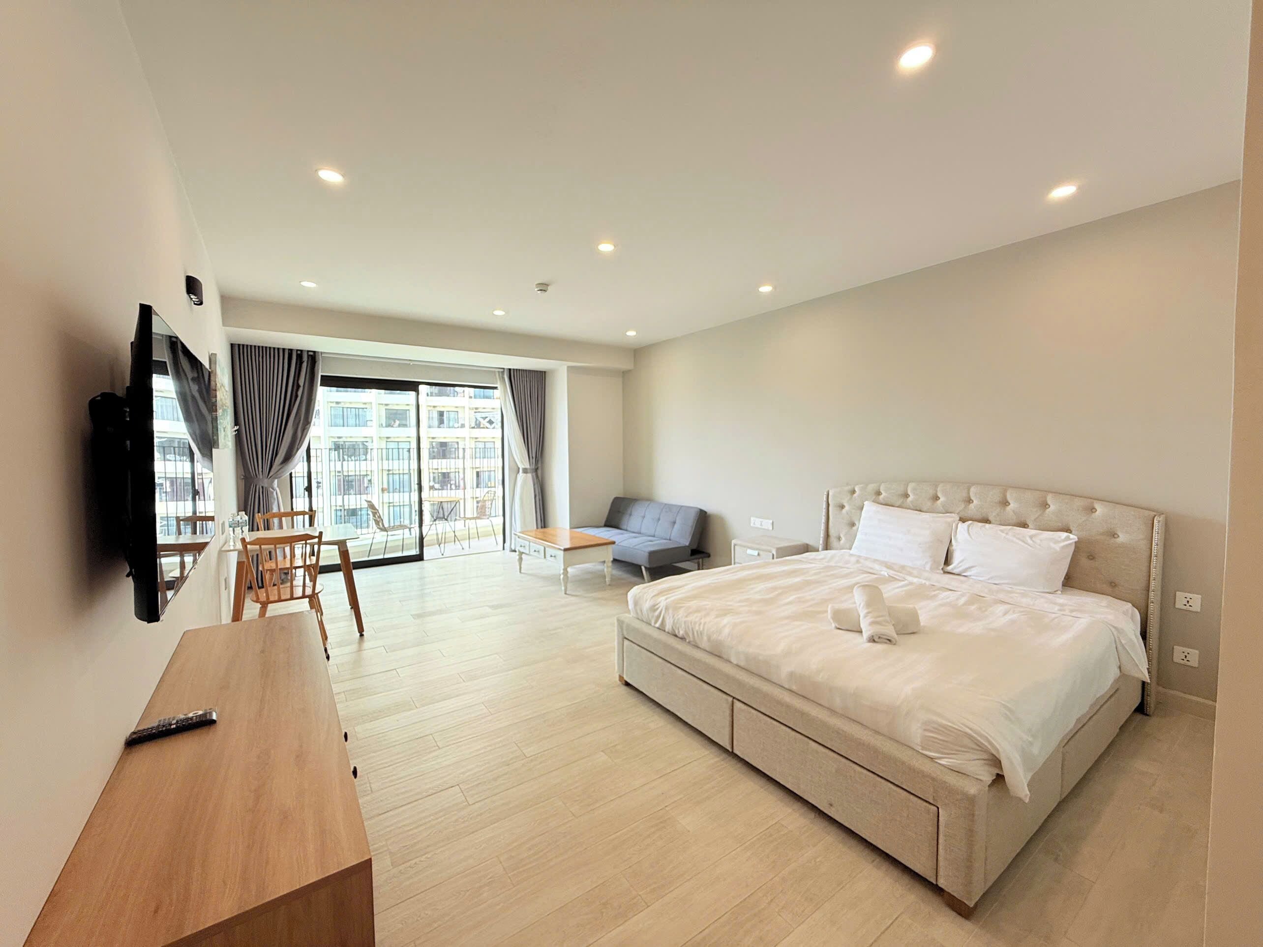 Premium bedding, desk, laptop workspace, blackout curtains