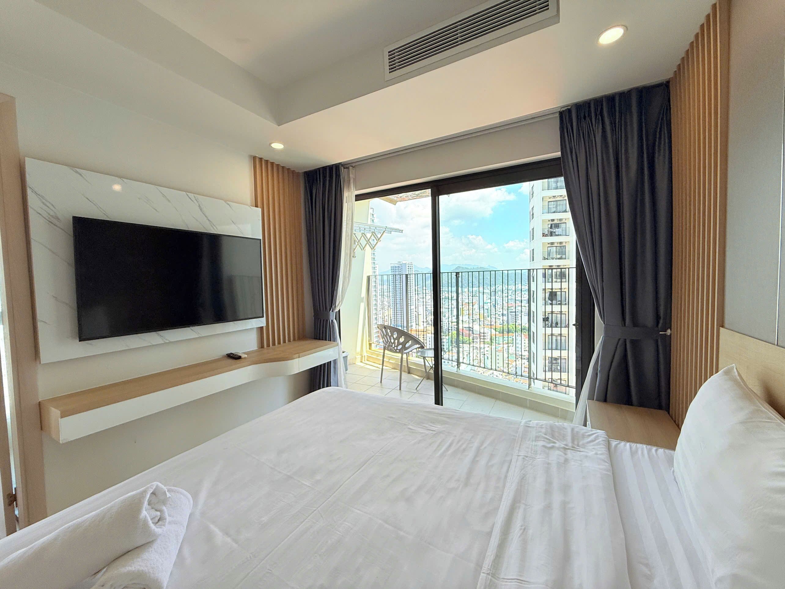 Premium bedding, desk, laptop workspace, blackout curtains