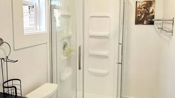 Shower, towels, soap, toilet paper