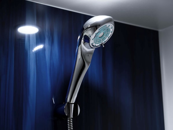 A modern showerhead with a sleek design. - Koraku Garden Hotel (Tokyo)