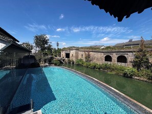 Indoor pool, pool umbrellas, pool loungers