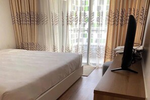 Suite Majestueuse, 1 chambre, accès au salon club, vue piscine | Draps en coton égyptien, literie de qualité supérieure