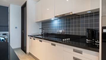 Appartamento familiare, vista collina | Cucina privata | Microonde, forno, piano cottura, tostapane