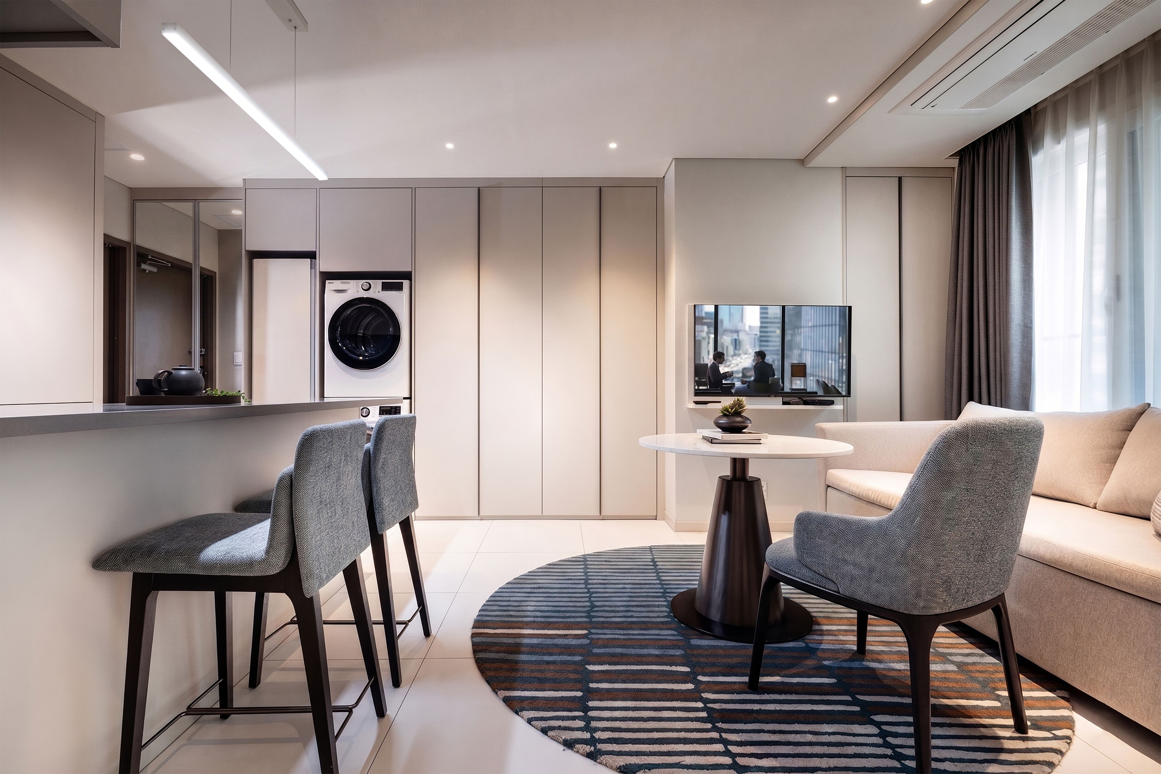 Junior Suite | Living area | 55-inch Smart TV with cable channels, heated floors