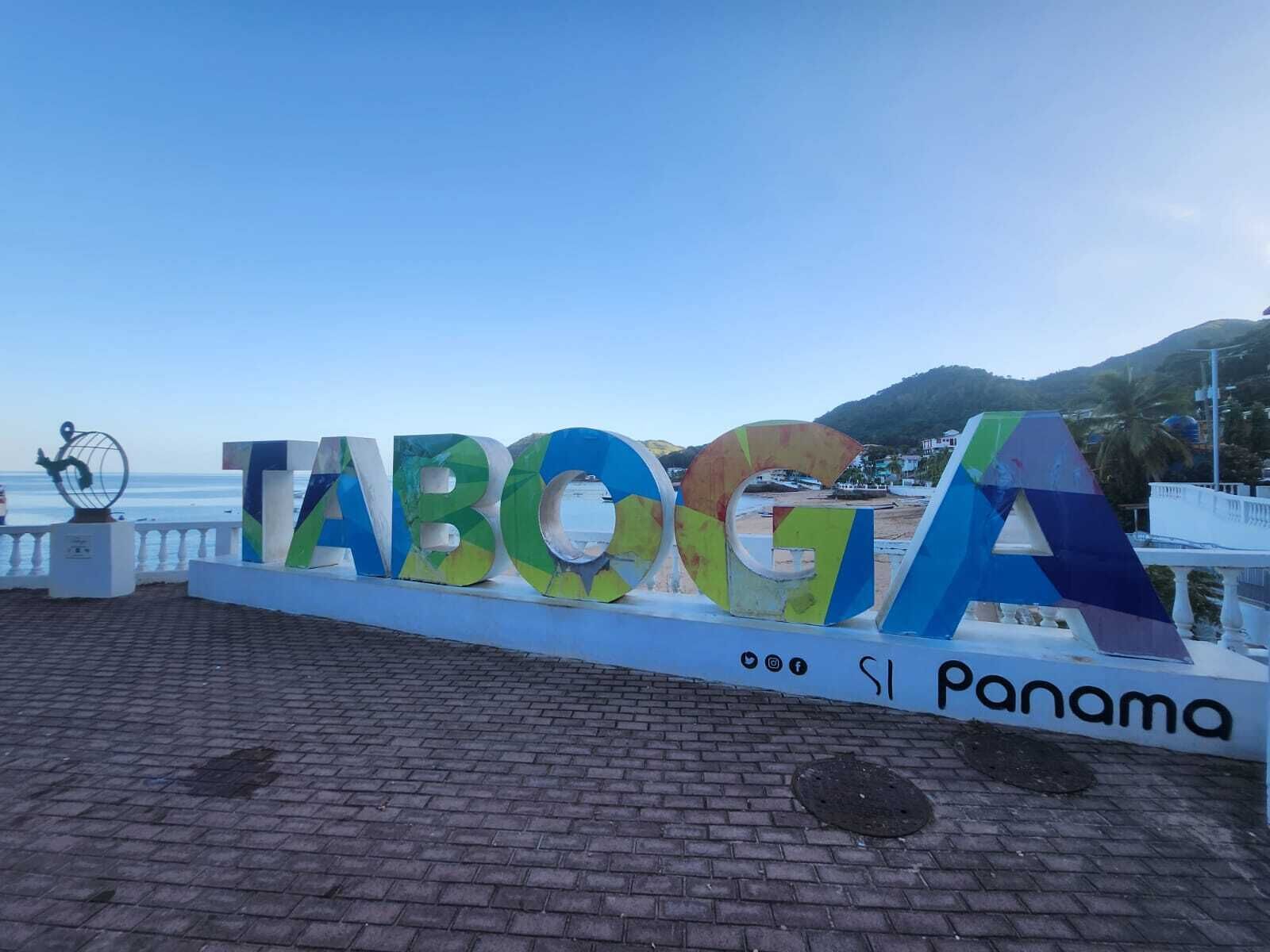 A sign with the word "TABOGA" and "Si Panama" indicating a location in Panama.