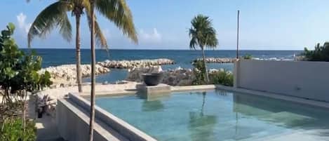 Outdoor pool, pool umbrellas, sun loungers