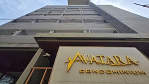 A high-rise building with a sign reading "AVATAR CONDOMINIUM". - Avatara Beachfront - Best Rooftop Pool & Ocean Views (Pattaya)