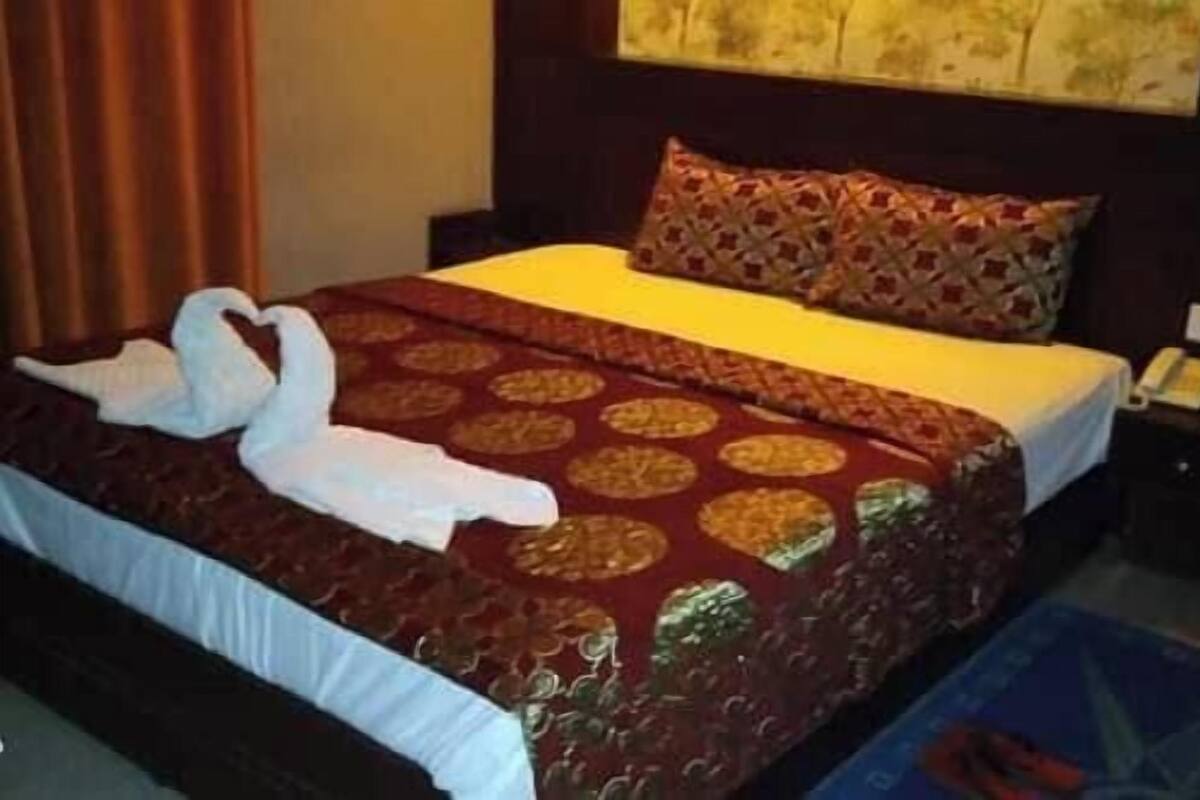 Habitación Deluxe con 1 cama matrimonial o 2 individuales, vista a la ciudad | Wifi gratis