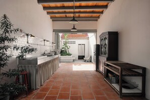 Family Townhome, City View | Private kitchen | Full-size fridge, microwave, stovetop, cookware/dishes/utensils