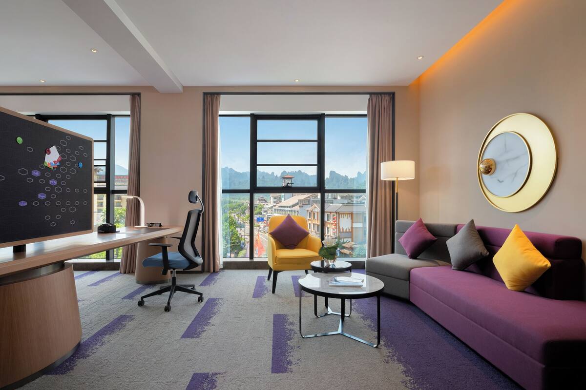 Luxury Suite, Mountain View | Desk, laptop workspace, blackout drapes, iron/ironing board