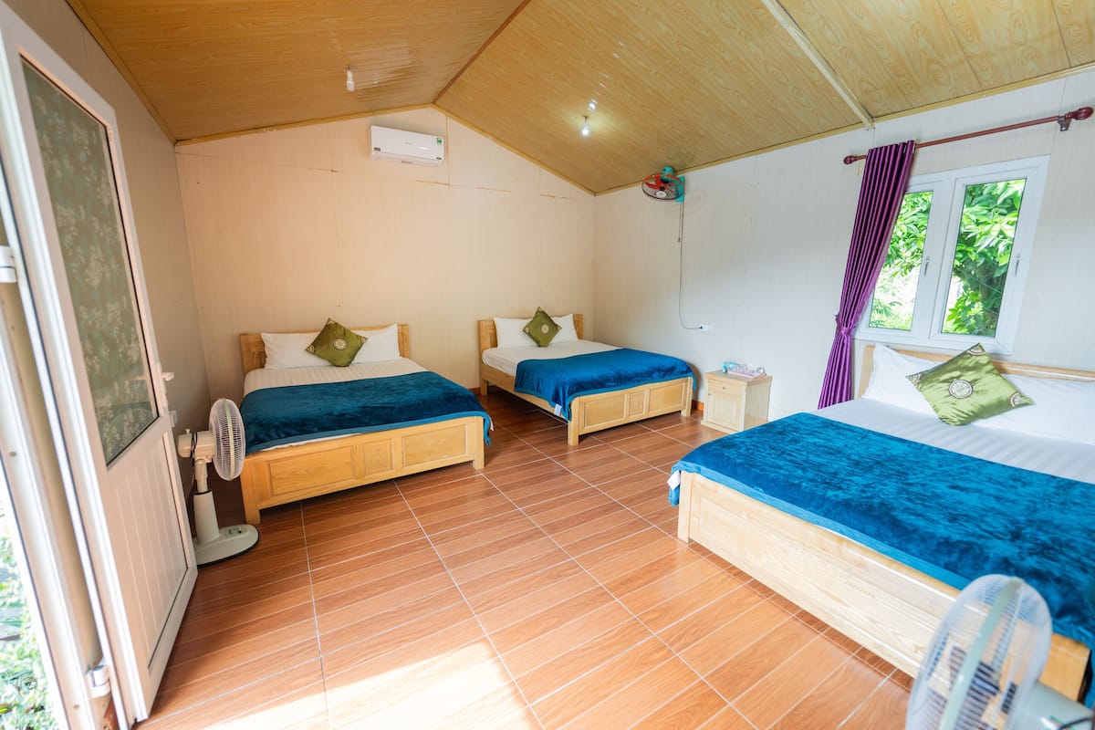 Family Triple Room, Garden View | Desk, laptop workspace, free WiFi, bed sheets