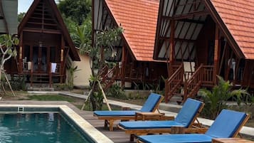 Deluxe Bungalow, Pool View | In-room safe, blackout curtains, free WiFi