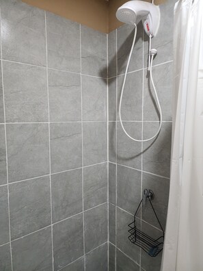 Comfort Apartment, Poolside | Bathroom | Shower, towels, soap, shampoo - Milo's Hostel and Residences  (Santa Ana)