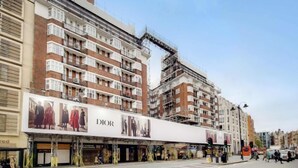 A multi-story building with a large Dior advertisement on the facade. - Princess Court Residences (London)