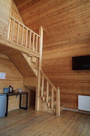 Svit Deluxe - utsikt mot poolen | Vardagsrum