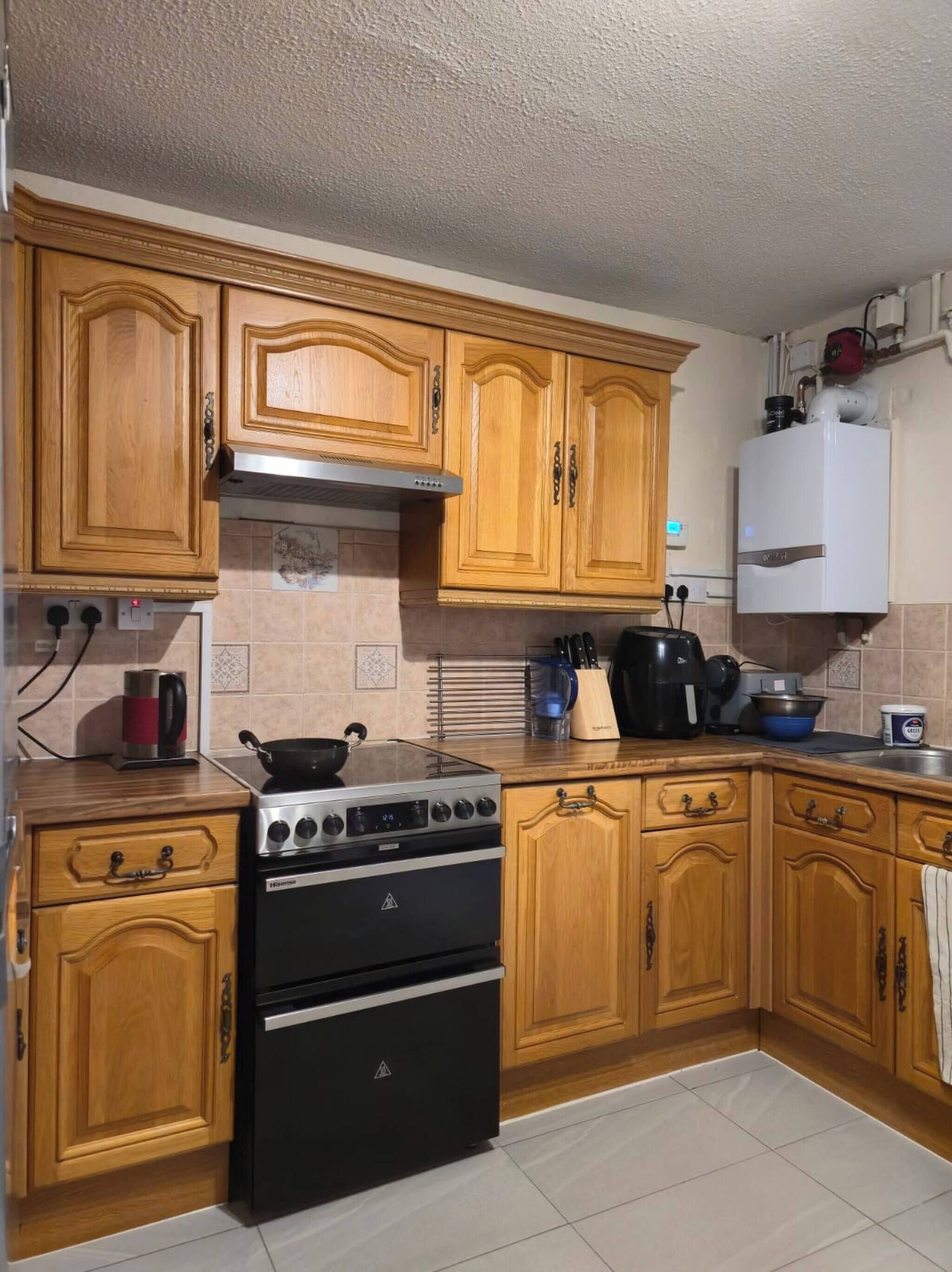 Fridge, microwave, coffee/tea maker, cookware/dishes/utensils