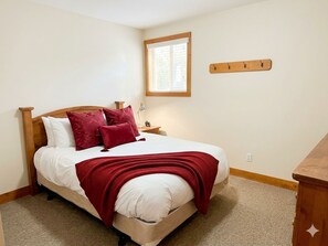 Bedroom #4 - Queen room on the main level. - Set at the base of Kimberley Alpine Resort, this spacious 5-bedroom, 4-bath townhouse comfortably suits two average-sized families. Ski in and out near the unit, walk about 2 minutes to the Express Quad Chair and base-area dining, then unwind in one (Kimberley)