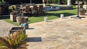 An outdoor patio with a pool, seating area, and potted plants. - Contemporary house at the gateway to the Luberon in a peaceful and relaxing setting (Pernes-les-Fontaines)