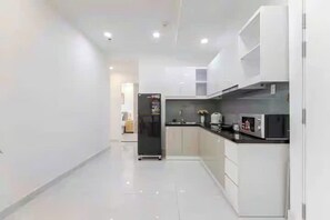 Presidential Suite, 2 Bedrooms, Club Lounge Access, City View | Private kitchen | Full-size fridge, microwave, oven, stovetop - Vivian Boutique Terra Royal Residence (Xuan Hoa)