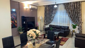 Deluxe Apartment, 2 Bedrooms, Balcony, City View | Living room | 40-inch flat-screen TV with satellite channels