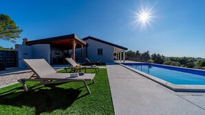 A modern house with a swimming pool, outdoor seating, and a covered patio. - Villa Antea by Villas Guide (Vela Luka)
